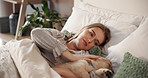 Relax, sleeping and woman in bed with puppy for bonding, home companionship or weekend wellness. Break, loyalty and scratching dog with pet owner in bedroom of apartment for safety, security or trust