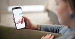Hands, phone screen and vacation destination with person in living room of home for reservation. Holiday booking, search and scrolling with woman in apartment for tourism website or travel options