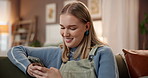 Laughing, phone and text message with woman on sofa in living room of home for break or relax. App, funny and social media with happy person in apartment for communication or internet browsing