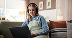 Education, laptop and music with woman on sofa in living room of home for online course or study. Computer, headphones and remote learning with college student in apartment for university scholarship