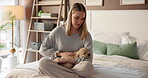 Home, woman and cuddle with puppy on bed for bonding together, connection and pet adoption. Love, happy dog mom and stroke furry best friend in bedroom for security, affection and domestic companion