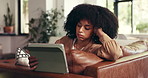 Woman, check watch or bored with tablet on sofa, tired and waiting for response on social media. African person, disappointed or tech in home with connection error, annoyed or fatigue in living room
