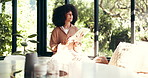 Thinking, window and black woman on tablet in home for online website, social networking and internet. House, living room and African person on digital tech for reflection, relax or wonder on weekend