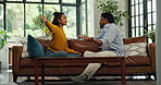 Frustrated couple, argument and sofa with fight or disagreement for cheating affair in home. Mad, man or woman in living room dispute with conflict for breakup, divorce or toxic relationship in house