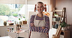Happy woman, face and painter arms crossed in workshop, creativity in career or hobby. Pride, talent and ambition with confidence, female artist in apron with smile and portrait in art studio