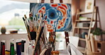 Painting, canvas and brushes in empty studio with abstract design, color pattern and texture. Artwork, tools and creation with art project, expression freedom and unique piece of final result in home