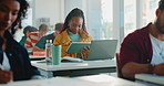 Tablet, laptop and black woman at university with studying for exam, assignment or test in classroom. Digital technology, computer and African student with research for college project with education