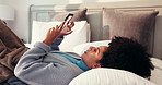 Scroll, relax and woman with phone in bedroom for reading blog, morning news or online shopping. Mobile, smile or African person in bed for browsing website, social media or internet purchase in home