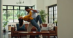 Happy couple, dancing and love in home, bonding and care with laugh in living room with connection. People, man and woman in relationship, rhythm and smile for loyalty, partner or trust at apartment