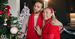 Christmas, decoration and tree with couple in living room of home together for festive celebration. Holidays, hug and smile of happy people in apartment for December season or winter tradition