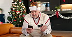 Credit card, christmas and mature man in home with phone for online shopping with festive season deals. Debit, cellphone and male person with ecommerce store for xmas discount in living room at house