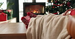 Christmas socks, feet and couple with cuddle on sofa for vacation break, cozy festive and bonding. Winter, blanket and people relax together in home for xmas holiday, relationship connection and love