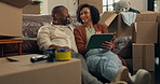 Moving in, couple and smile with tablet in new house for home renovation, digital layout or mortgage. Interior design, app and property investment with boxes, man and woman for real estate purchase
