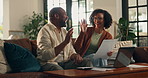 Happy, black couple and documents with high five in home for finance, teamwork or investment. Man, woman and paperwork with laptop on sofa for financial success, loan approval or insurance in house