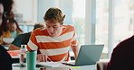 Education, laptop and reading with student in classroom for college course, lecture or lesson. Computer, learning and notebook with man in university class for development, future or scholarship