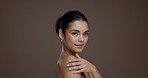 Shoulder, skincare and smile with face of woman in studio for beauty, body care and hydration. Aesthetic, dermatology and natural glow with female model on brown background space for collagen