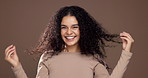Woman, face and happy for hair care, studio and touch for volume, growth and space on background. Girl, person and excited with curly hairstyle, confidence and benefits with texture in Costa Rica
