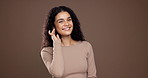 Happy woman, face and touch with smile in studio for makeup on a brown background. Portrait, female person or model with self confidence, satisfaction and cosmetics or treatment on mockup space