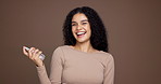 Happy woman, spray and studio with perfume for aroma, ordor or fragrance on a brown background. Portrait, female person or model with smile, cologne or product for hygiene or scent on mockup space
