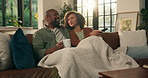 Couple, remote and smile in house for decision, movie and bonding on sofa with subscription service. Man, woman and watching tv in living room for film, love or streaming with discussion on couch