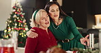 Christmas, hug and woman with senior mother for greeting, thank you or gratitude in festive season. Love, bonding and female person embracing elderly mom for xmas celebration at family home together.