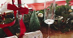 Christmas, decorations and table setting in dining room for festive celebration, event or lunch. Holidays, champagne glass and tableware for xmas party with social gathering in December in home