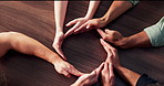 Circle, hands together and business people in office with teamwork, solidarity and synergy. Top view, collaboration and group of corporate employees with palms for partnership, unity and goals.