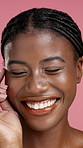 Skincare, happy and face of black woman in studio with confidence, skin glow and natural beauty. Salon, aesthetic and portrait of person laugh for dermatology, shine and health on pink background
