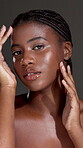 Skincare, glow and hand with face of black woman in studio for beauty, shine and dermatology. Pride, collagen and hydration with female person on dark background for self care and clear skin