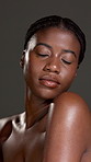 Natural, glow or black woman in studio with body care, treatment or skin hydration. Shine, shoulder or African female person isolated grey background with smooth texture, beauty or hygiene cosmetics