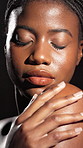 Touch, glow or black woman in studio with body care, treatment or skin hydration. Shine, shoulder or African female person isolated dark background with smooth texture, beauty or hygiene cosmetics