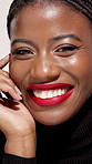 Face, beauty makeup and black woman with lipstick, glow and happy for aesthetic in studio. Portrait, smile and African model with cosmetics, red lips and shine with confidence for skincare with gloss