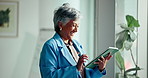 Mature, happy woman or research with tablet for business investment or trading in office. Female person, investor or trader with smile on technology for stock market, profit or revenue in workplace