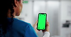Woman, hands and nurse with phone or green screen for telehealth app, advertising or marketing. Back view, female person or medical worker with mobile smartphone display for healthcare UI or mockup