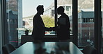 Business people, silhouette and handshake with documents in office for meeting, negotiation or deal. Businessman, woman or employees shaking hands with paperwork for corporate proposal in workplace