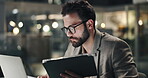 Man, laptop and tablet in office at night for accounting, finance planning and budget report. Male person, reading and digital for financial comparison, results and information of investment deadline