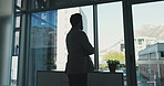 Thinking, window and business man in office for proposal ideas, finance planning and problem solving. Corporate, shadow and back of worker with professional mindset, solution and investment decision