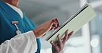 Hands, nurse and tablet in hospital for healthcare schedule, information or review medical history. Technology, woman and worker in clinic for typing email, update report and research on internet