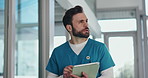 Man, nurse and thinking with tablet in hospital for medical research, schedule or planning. Male person, healthcare worker or contemplating with technology for health results, analysis or report