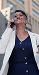 Mature businesswoman, phone call and happy in city for contact, networking or low angle in street. Person, smartphone and listen in urban town with funny chat, laugh and commute with smile in Mexico