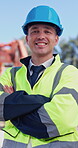 Arms crossed, face and smile of construction worker man outdoor for development or engineering. Architecture, building and maintenance with happy developer on industrial site for project management