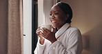 Hotel, thinking and black woman drinking coffee on holiday, vacation and laugh for hospitality. Resort, tea and happy person relax to blow steam, funny and daydreaming with inspiration by window view
