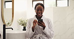 Bathroom, phone and funny black woman with morning routine, scroll message or social media. Robe, home and happy person with mobile to laugh at meme, spa blog and reading text with comedy on internet