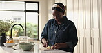 Black woman, happy and cutting board for fruit in kitchen for breakfast, diet or meal for wellness in home. African person, smile and banana for smoothie, health or nutrition with organic produce