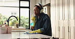 Headphones, woman and singing with spray for cleaning kitchen, dancing and counter disinfection. Maid, music playlist and black person with gloves in home for fun domestic chores, dance or sanitation