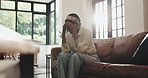 Black woman, headache and sofa with stress for depression, anxiety or burnout in home. Tired, female person exhausted with migraine or pain for discomfort or fatigue on living room couch in house