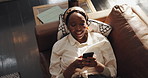 Typing, sofa and black woman with phone in home for social media, online message and funny website. Living room, apartment and person on smartphone laughing for internet, networking and connection