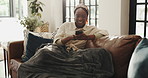 Happy, sofa and black woman with phone in home for social media, online message and funny website. Living room, apartment and person on smartphone laughing for internet, networking and connection