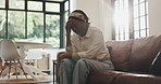 Black woman, headache and sad with stress on sofa for depression, anxiety or burnout in home. Tired, female person or thinking with migraine or pain for fail, discomfort or fatigue on couch in house