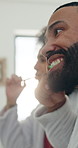 Couple, brushing teeth and hygiene in bathroom, mirror or cleaning mouth for morning routine in home. Man, woman and bamboo toothbrush with oral health, benefit or dental wellness with sustainability